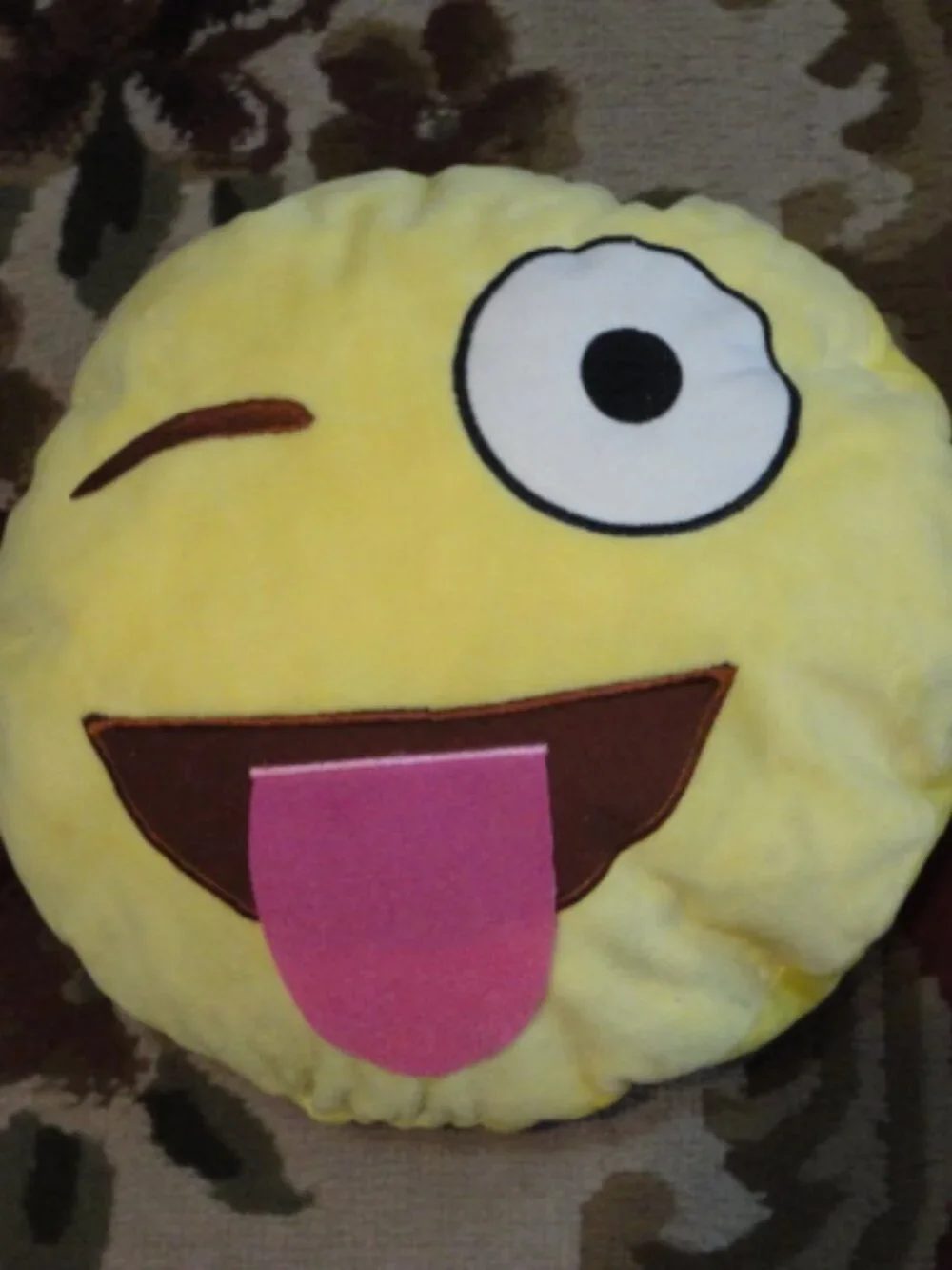 Yellow Emoji Pillow Blinking Eye Tongue Out